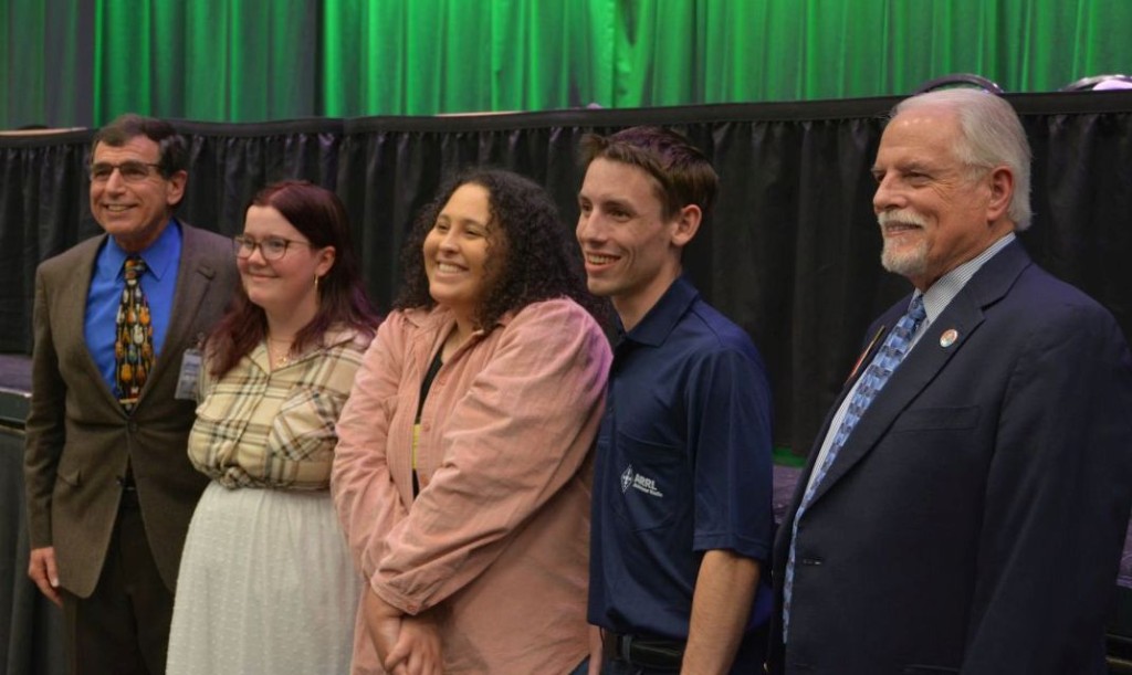 SEA-PAC MC Arnie Klein with 2023 Recipients Sarah Adams & Hannah Rosenfeld, 2022 Recipient Declan O'Hara and ARRL President Rick Roderick